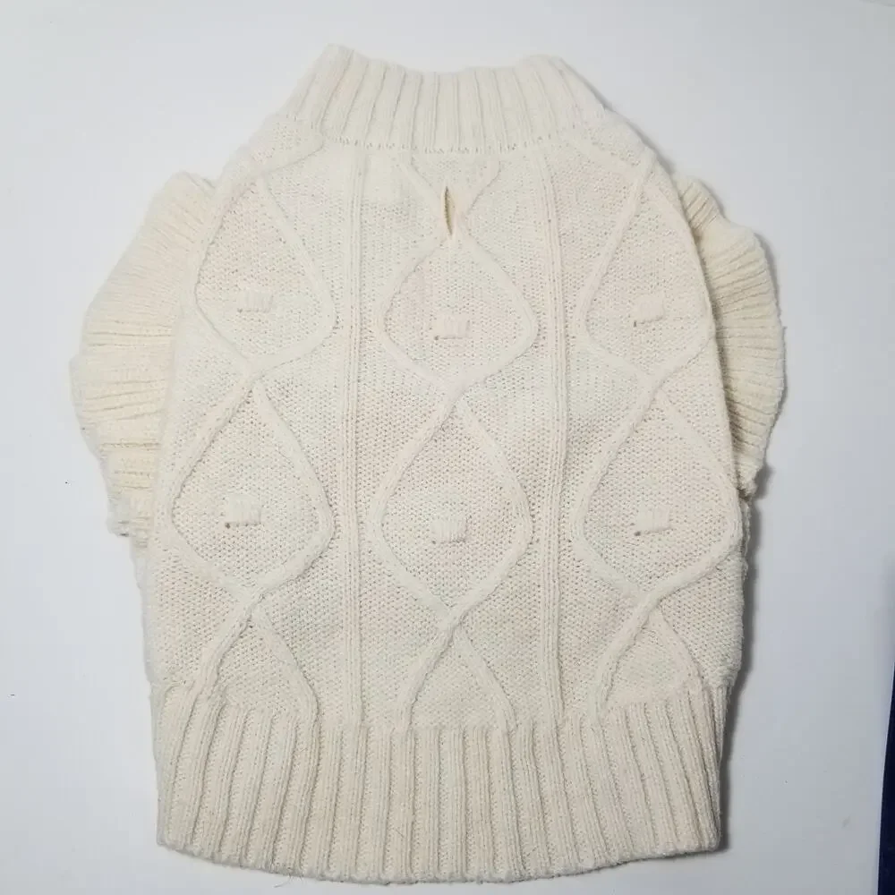 small girl doggie light sweater  one small faint stain on underside of sweater